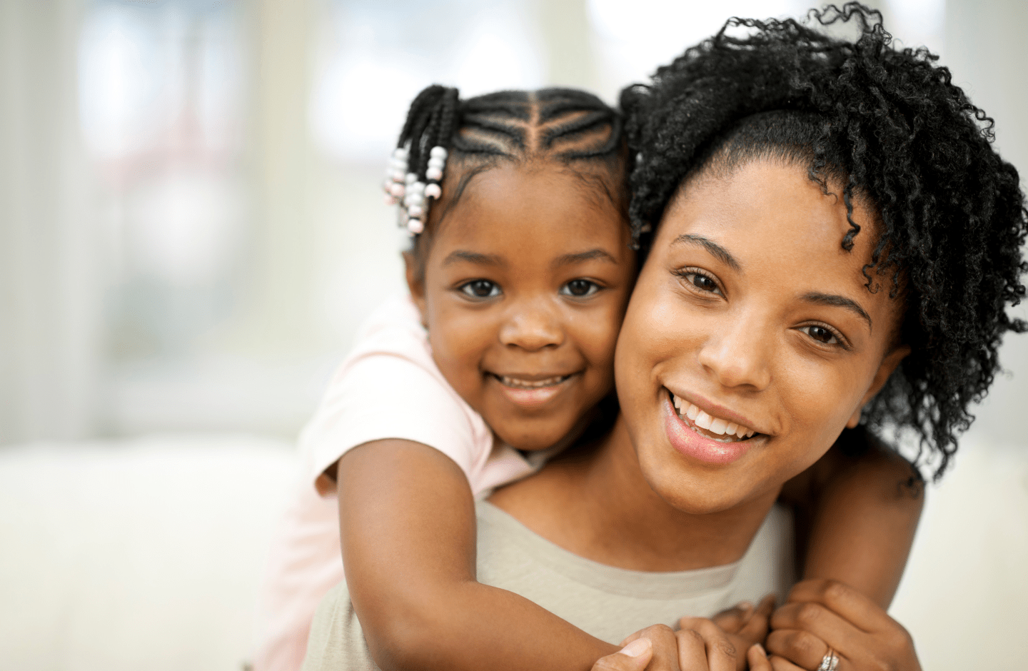 mother and daughter smiling